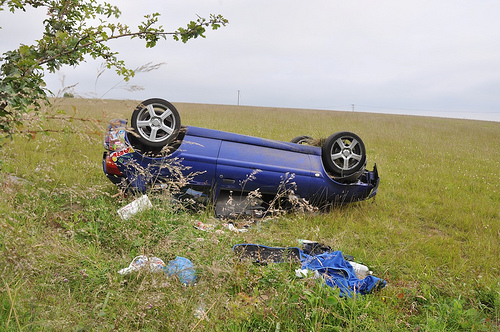 Overturned car with debris