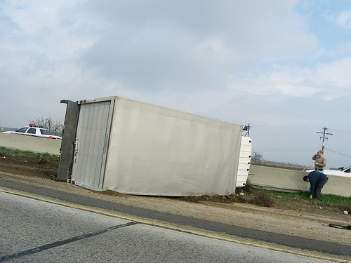 Single-unit truck on its side