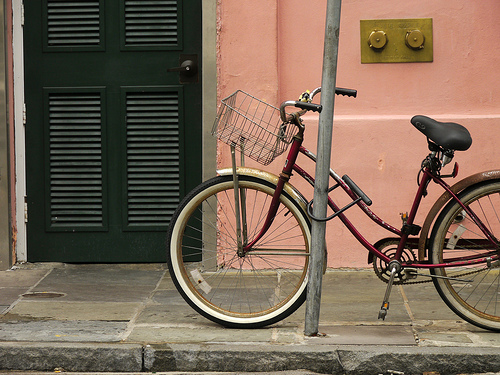 bicycle locked to signpost